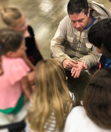 beekeeper educating students